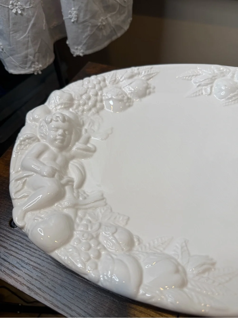 White glazed ceramic oval serving platter classical bacchanalian cherub embossed